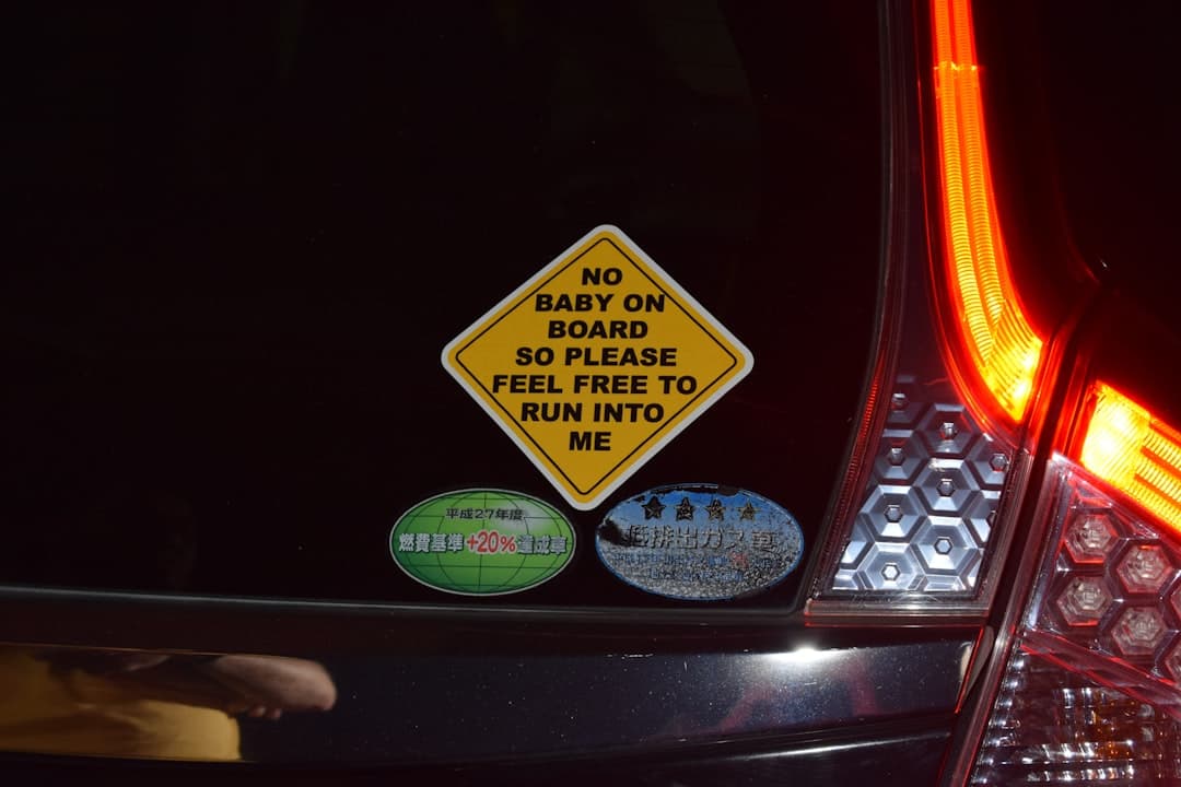 Diamond shaped sticker on car reads 'no baby on board'