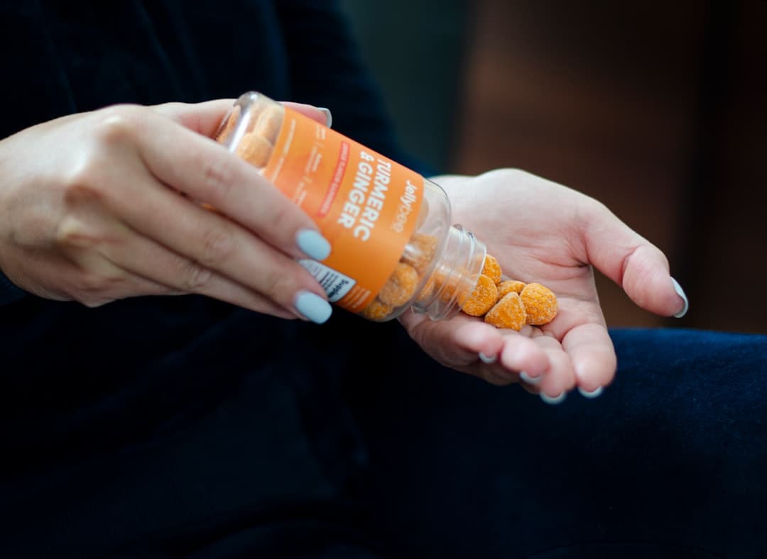 orange and white plastic bottle